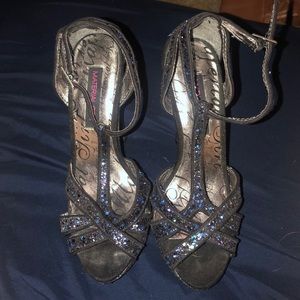 Black sparkly high heels.